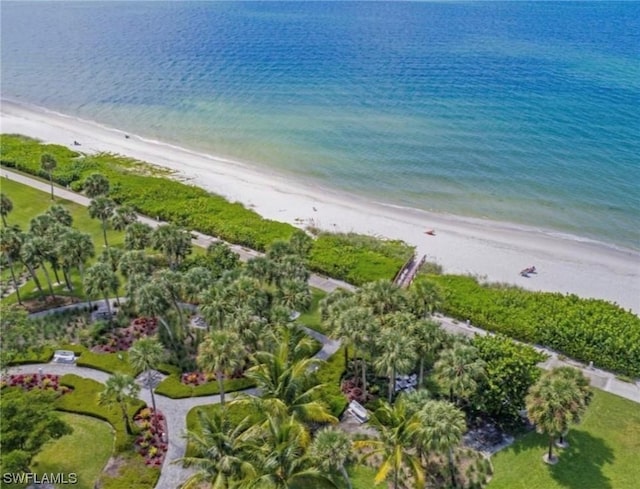 birds eye view of property with a water view and a view of the beach