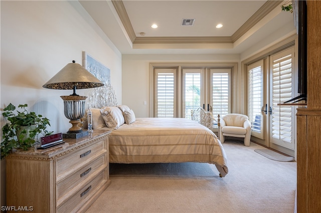 bedroom featuring light carpet, a raised ceiling, access to outside, and crown molding