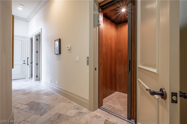 hall with crown molding and light tile flooring