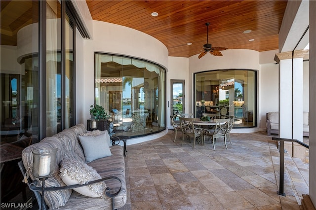 view of patio featuring ceiling fan