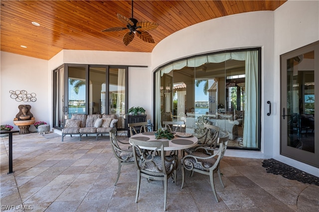 view of patio with outdoor lounge area and ceiling fan