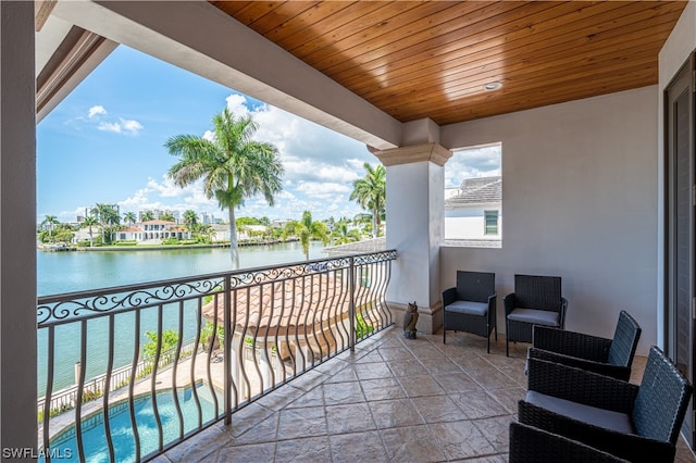 balcony featuring a water view