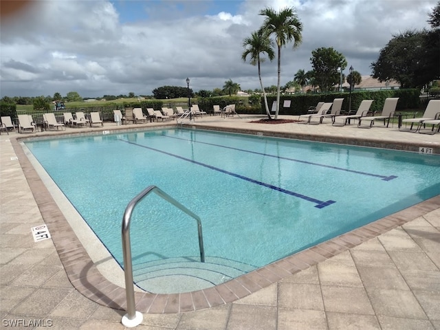 view of swimming pool featuring a patio