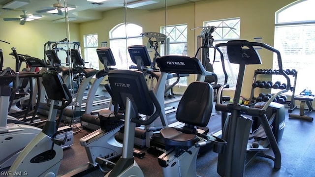 gym with plenty of natural light and ceiling fan