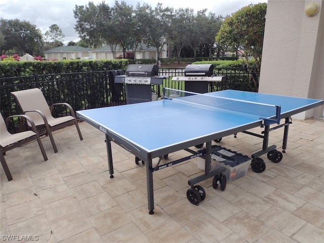 recreation room featuring light tile floors