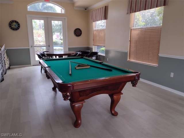 playroom featuring pool table, crown molding, and light hardwood / wood-style flooring