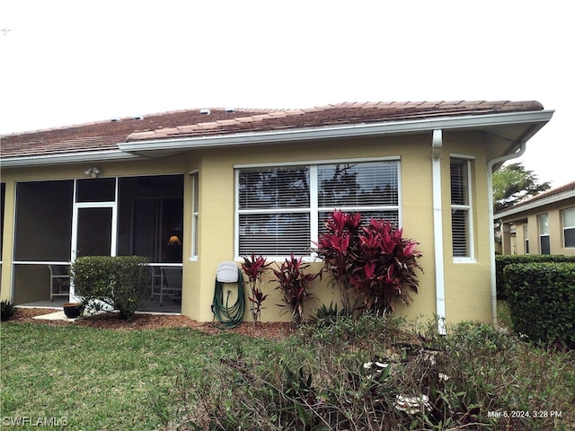 exterior space featuring a sunroom