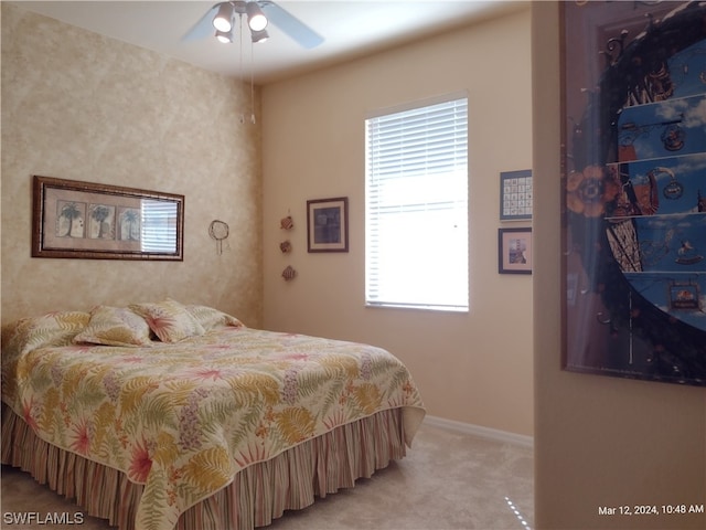 bedroom featuring light carpet and ceiling fan