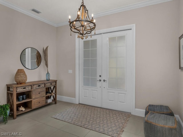 entrance foyer with french doors, ornamental molding, light tile flooring, and a chandelier