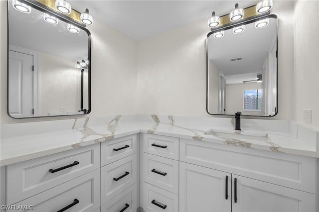 bathroom featuring dual vanity