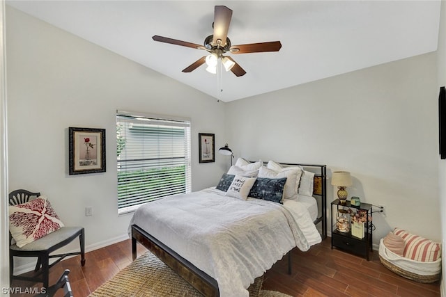 bedroom with dark hardwood / wood-style flooring, ceiling fan, and lofted ceiling