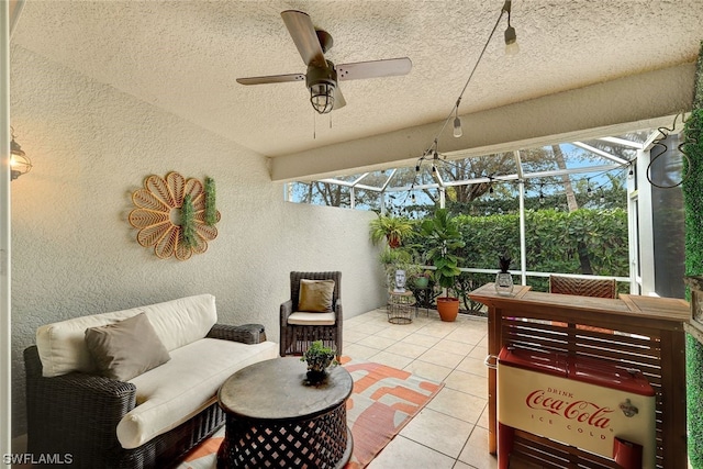 sunroom with ceiling fan and a wealth of natural light