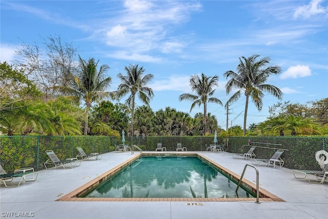 view of swimming pool featuring a patio area