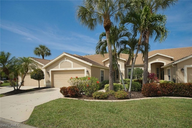 ranch-style home with a front lawn and a garage