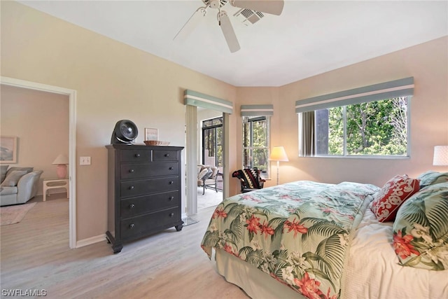 bedroom with ceiling fan and light hardwood / wood-style flooring