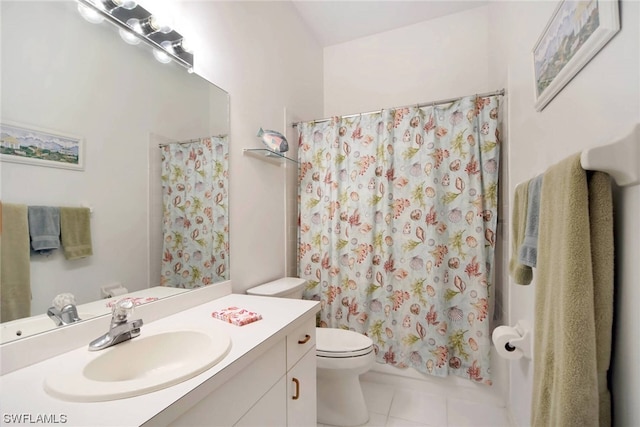 bathroom with tile patterned floors, vanity, and toilet