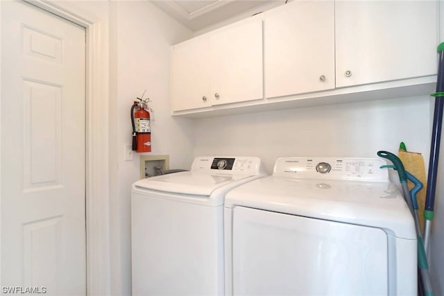 laundry area featuring cabinets and washer and dryer