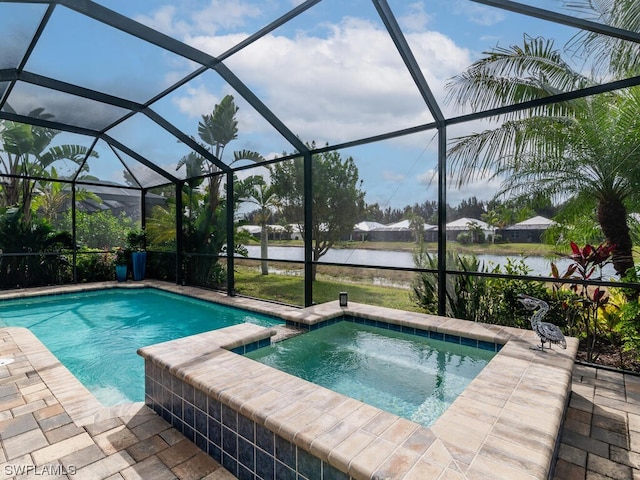 view of swimming pool with a patio, an in ground hot tub, and a lanai