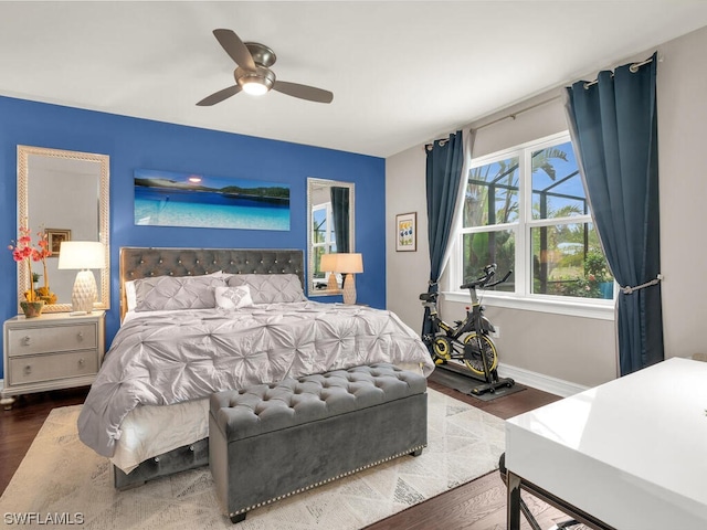 bedroom with ceiling fan and hardwood / wood-style flooring