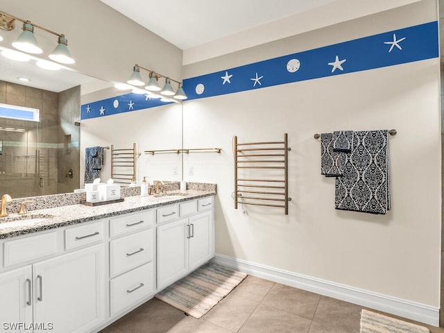 bathroom featuring tile floors, a shower with shower door, radiator heating unit, and dual bowl vanity