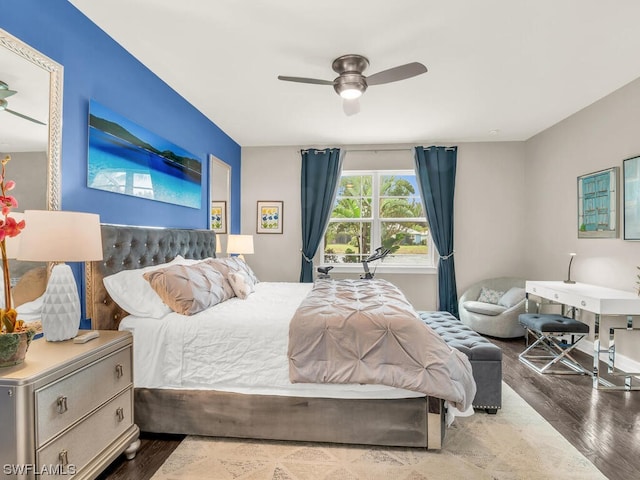 bedroom featuring ceiling fan and dark wood-type flooring