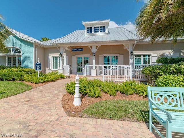 rear view of property with a porch