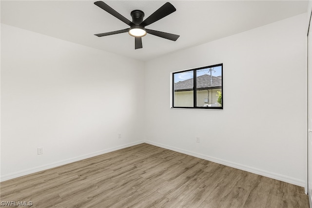 spare room featuring ceiling fan and light wood-type flooring