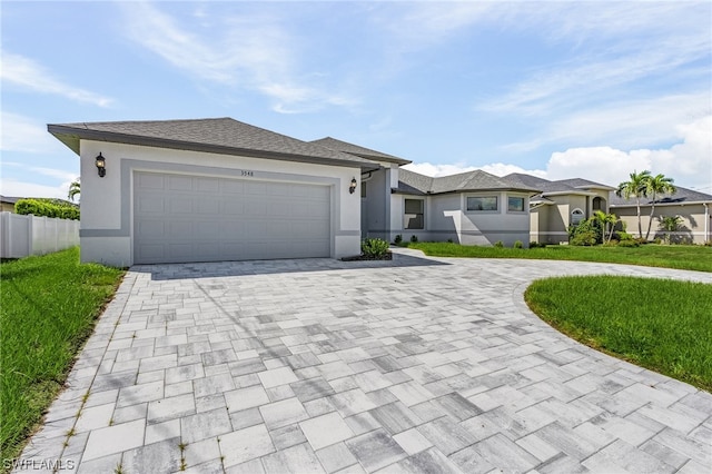 view of front of home with a front lawn and a garage