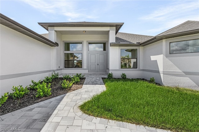 entrance to property with a yard