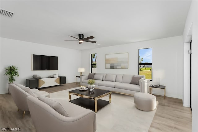 living room featuring ceiling fan and light wood-type flooring