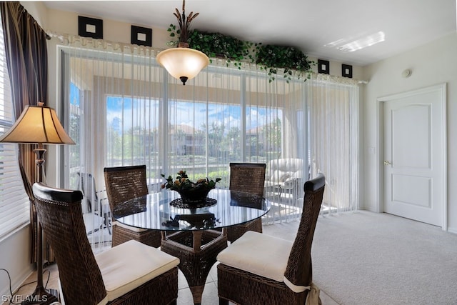 dining space with light carpet