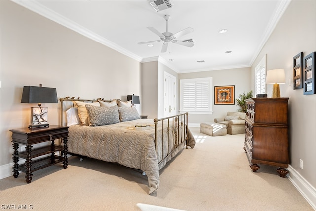 carpeted bedroom with ceiling fan and crown molding