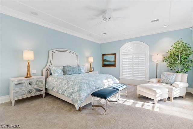 bedroom featuring carpet flooring, ceiling fan, and crown molding