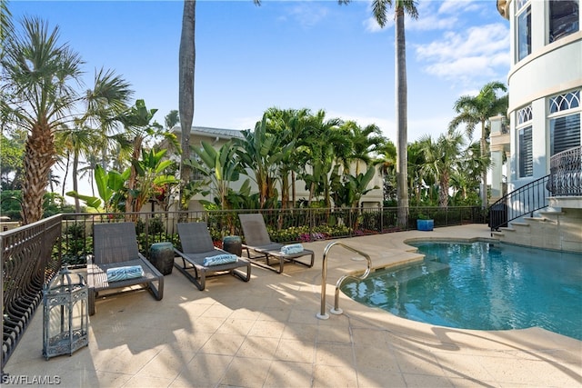 view of swimming pool featuring a patio area