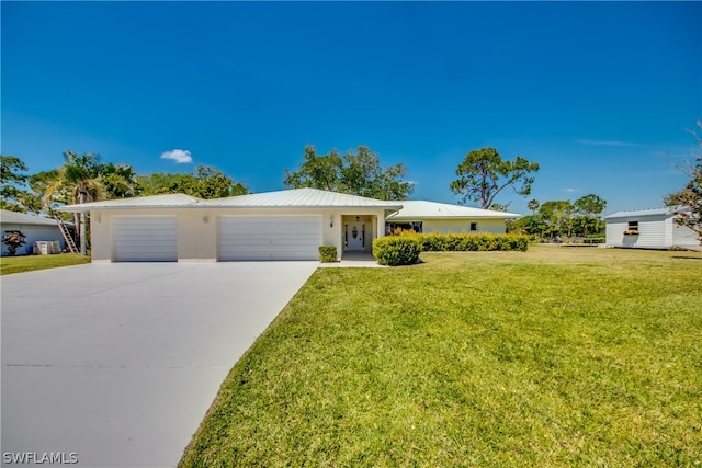 ranch-style house with a front yard and a garage