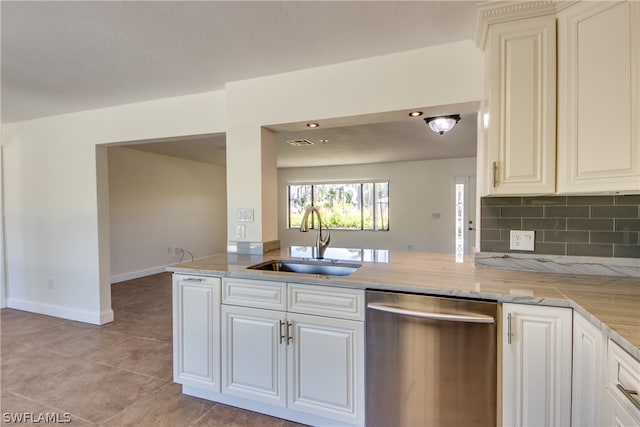 kitchen featuring light tile flooring, kitchen peninsula, sink, stainless steel dishwasher, and tasteful backsplash