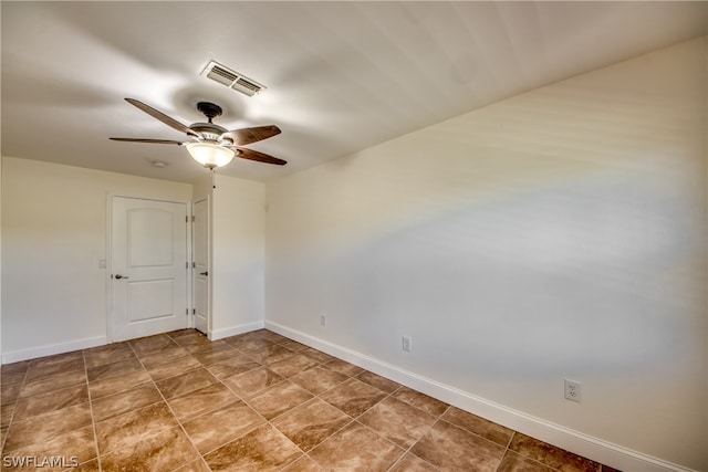 unfurnished room with ceiling fan and tile floors