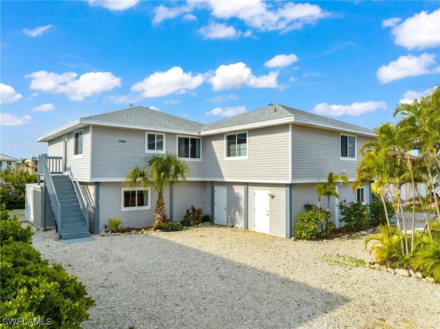 back of property featuring a garage