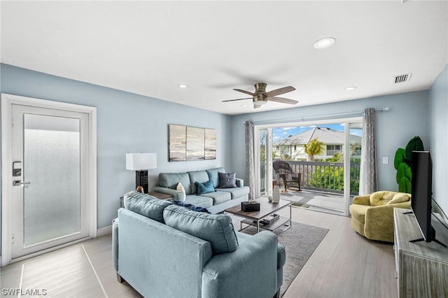 living room featuring ceiling fan