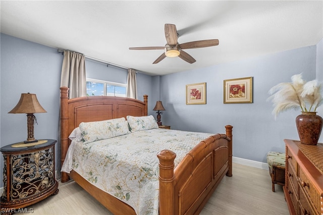 bedroom featuring ceiling fan and light wood-type flooring