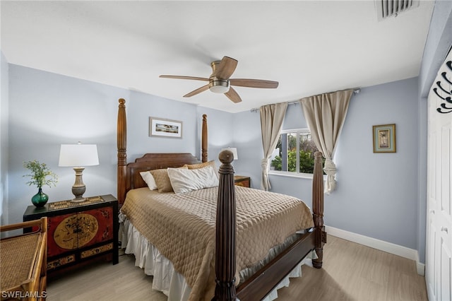 bedroom with a closet, ceiling fan, and light hardwood / wood-style flooring