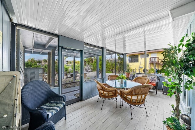 sunroom / solarium featuring wooden ceiling