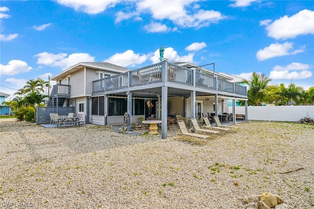 rear view of property with a patio area and a wooden deck