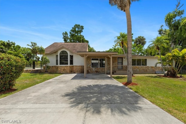 ranch-style home featuring a front yard