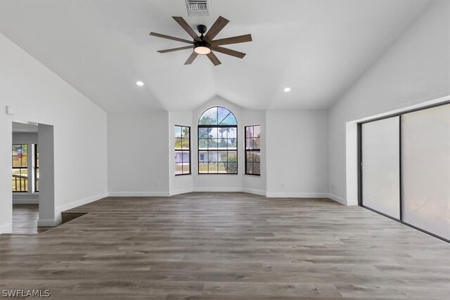 spare room featuring ceiling fan, vaulted ceiling, and hardwood / wood-style flooring