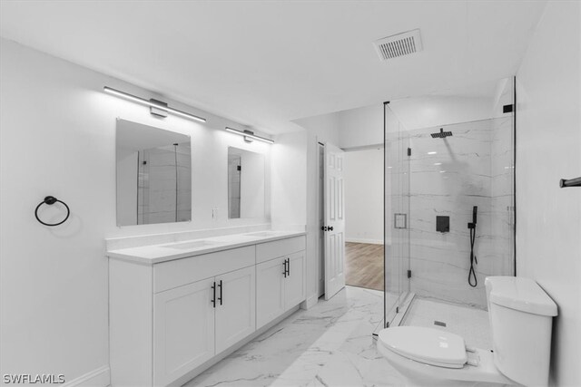 bathroom with tile floors, an enclosed shower, toilet, and vanity