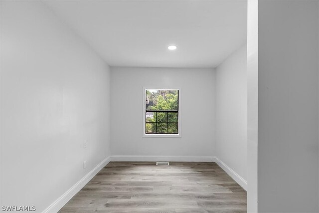 spare room featuring light wood-type flooring