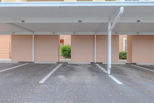 garage featuring a carport