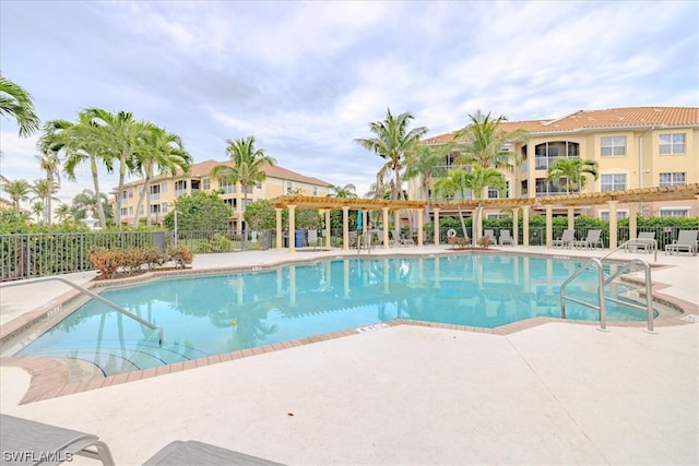 view of swimming pool with a patio