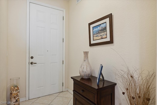 view of tiled foyer entrance